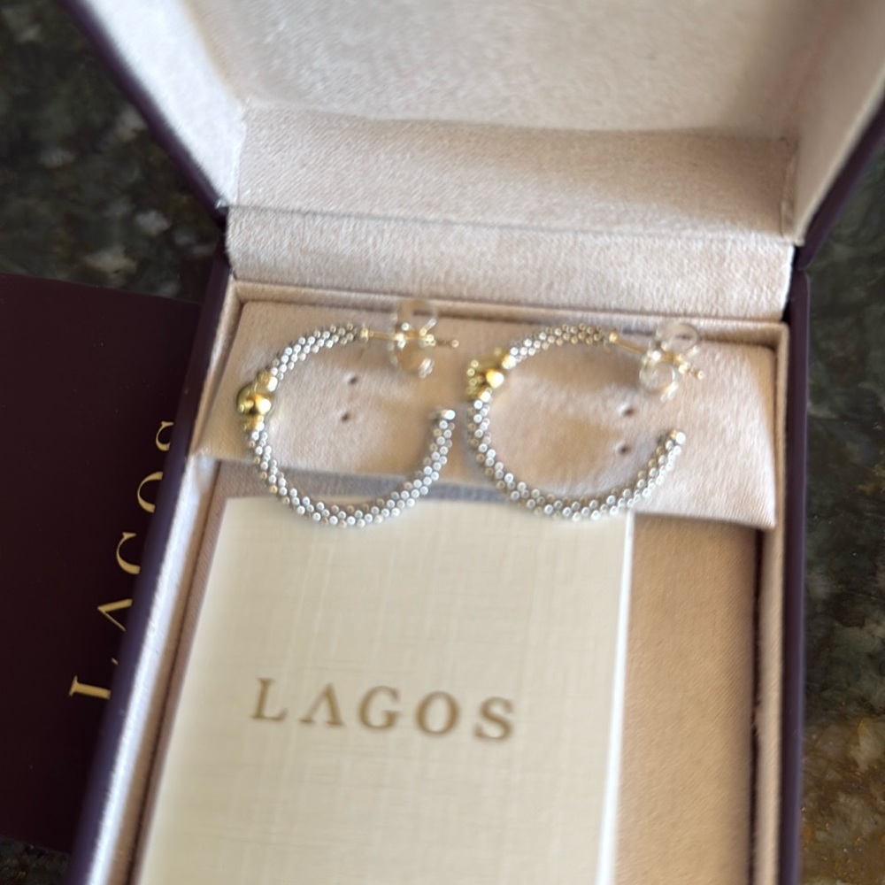Lagos 25mm circle station hoops.  Sterling silver and 18k yellow gold.